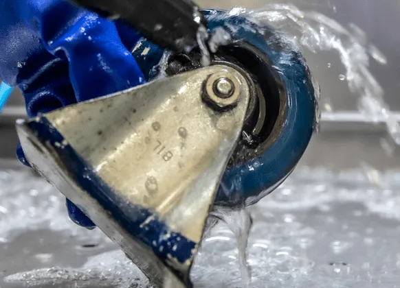 Closeup of wheel being washed in Aqueous solution