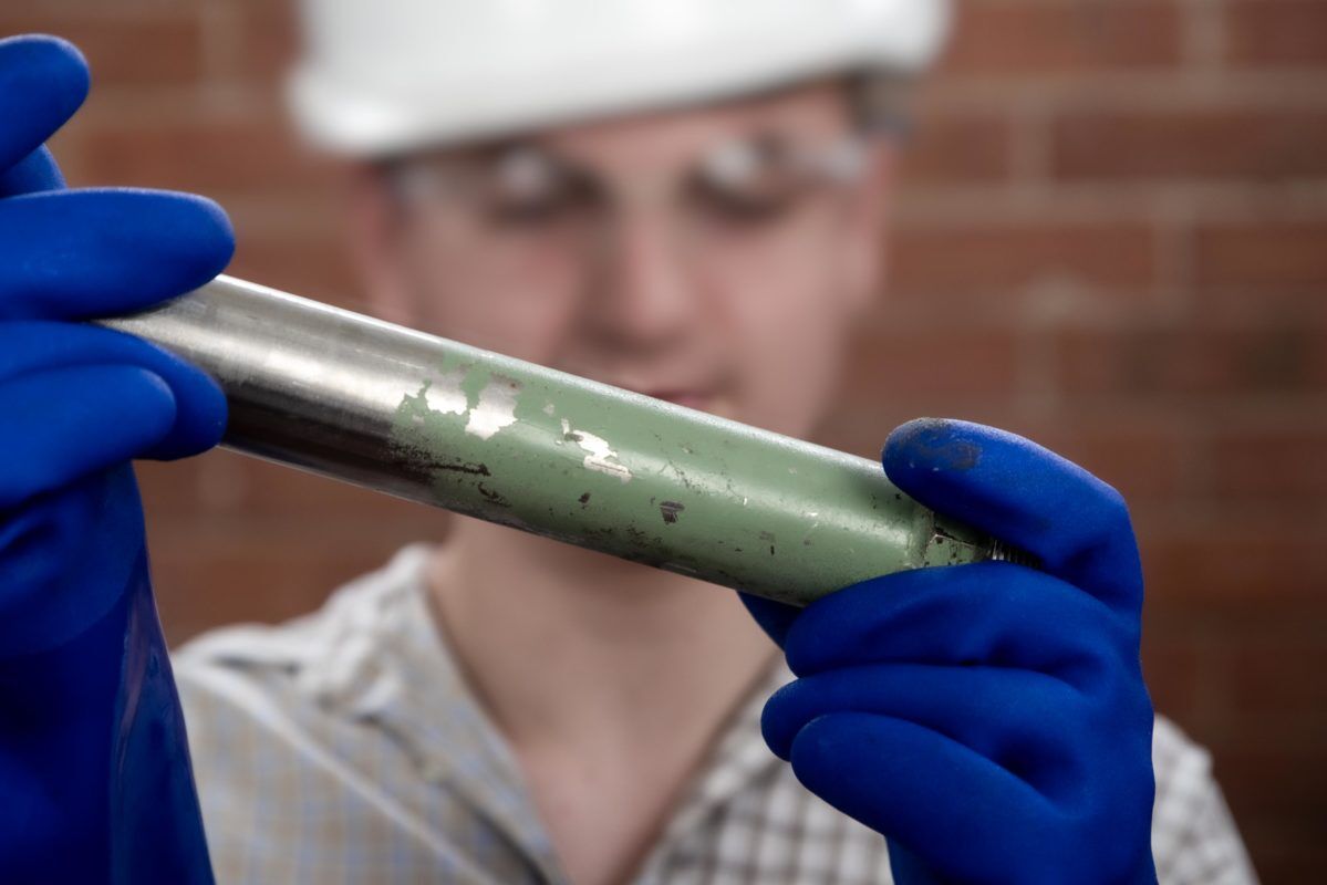 Man inspecting a component