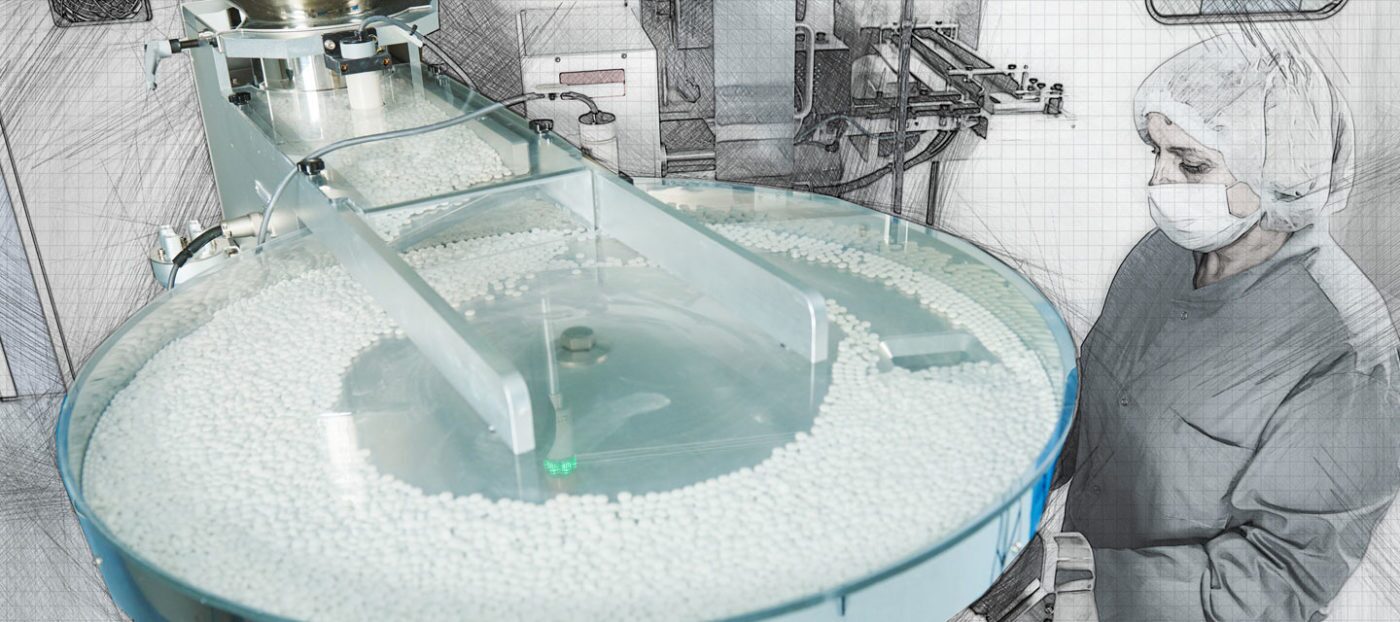 Worker in mask visually inspecting pill manufacturing process