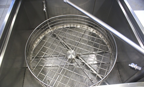 Close up of Aqueous basket in parts washer