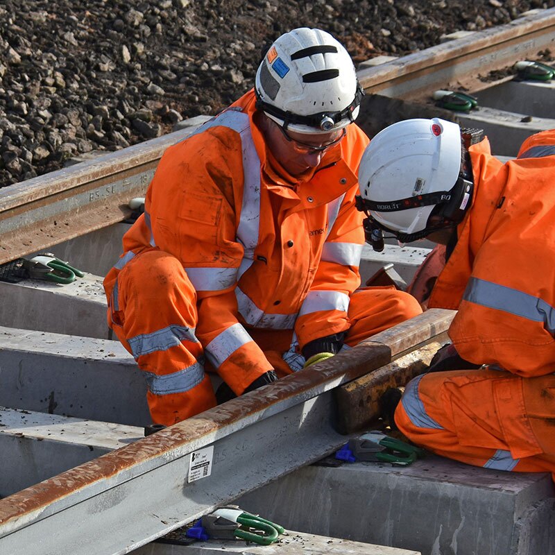Rail workers carrying out maintenance on line