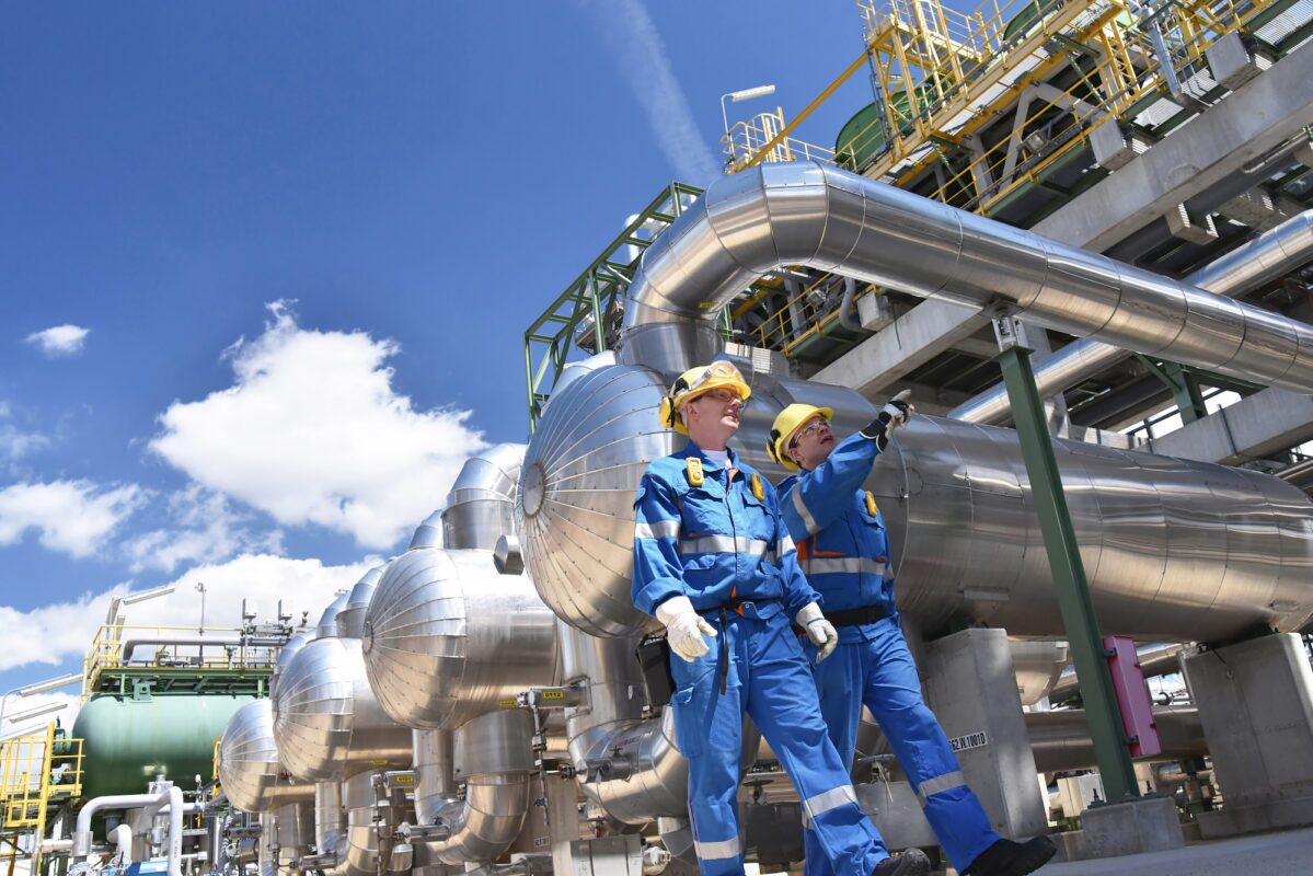 Two men at an oil refinery