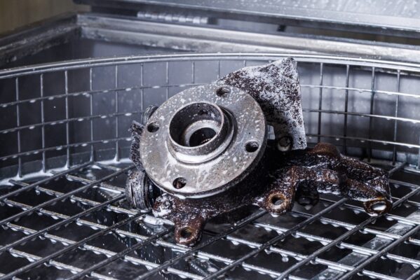 Part cleaned in auto aqueous parts washer