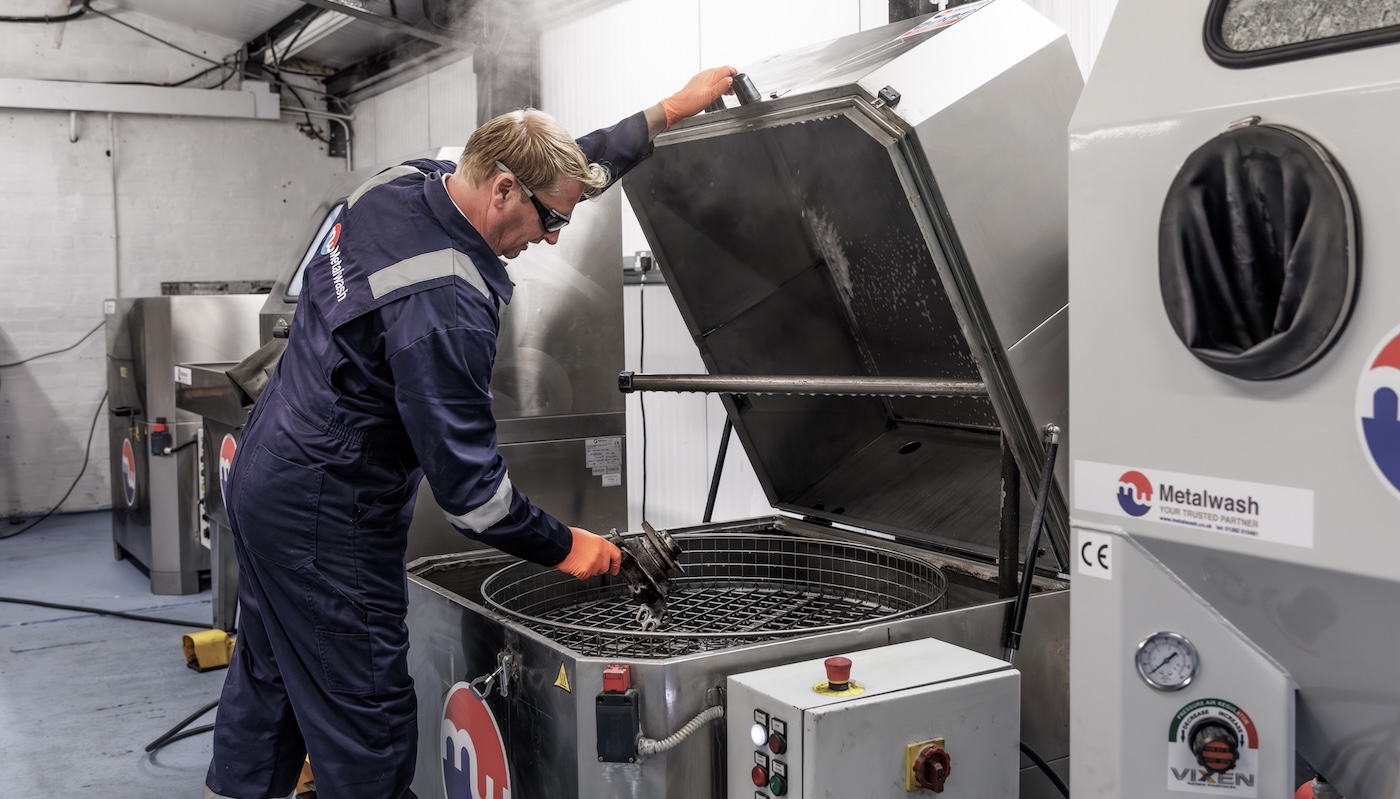 Parts washers being serviced in a worksop